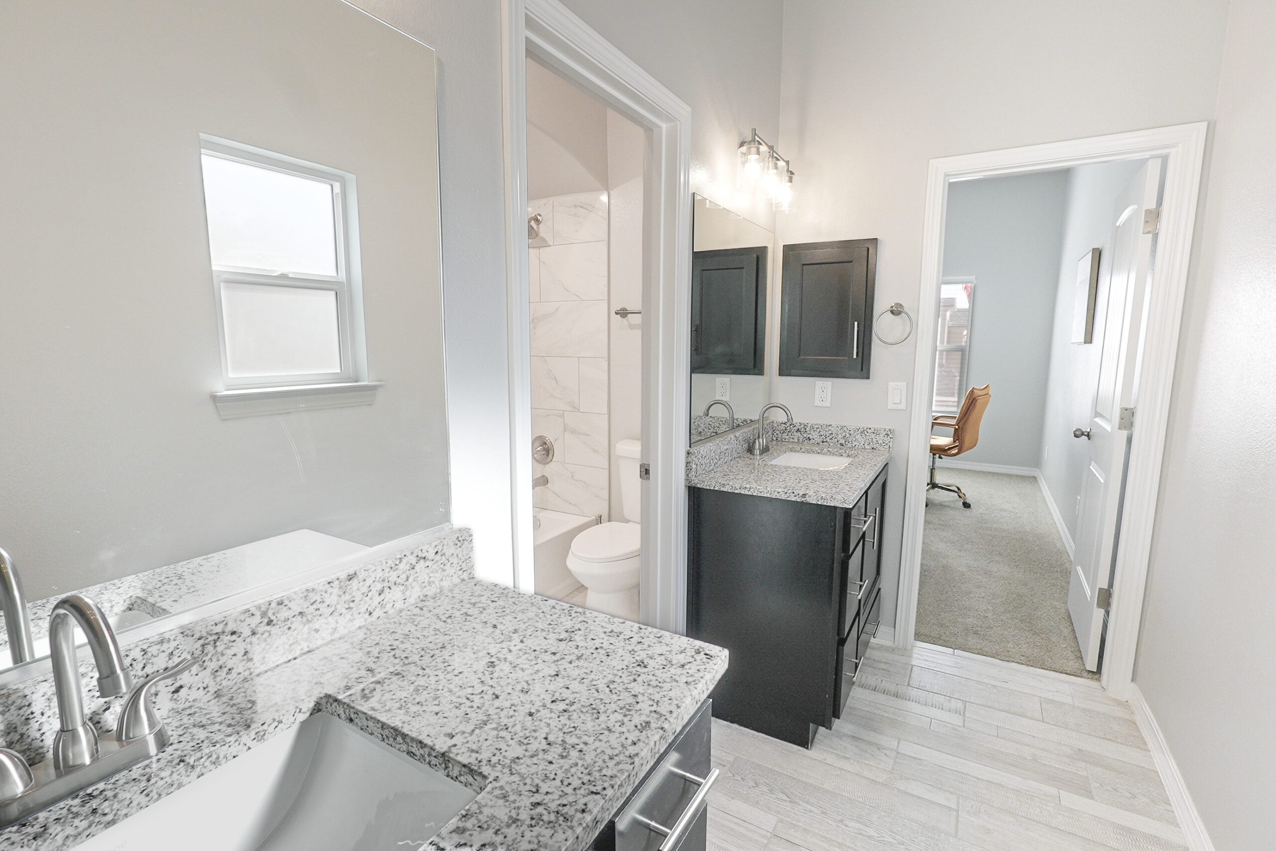The Orchid Bathroom with separate sinks and open space.