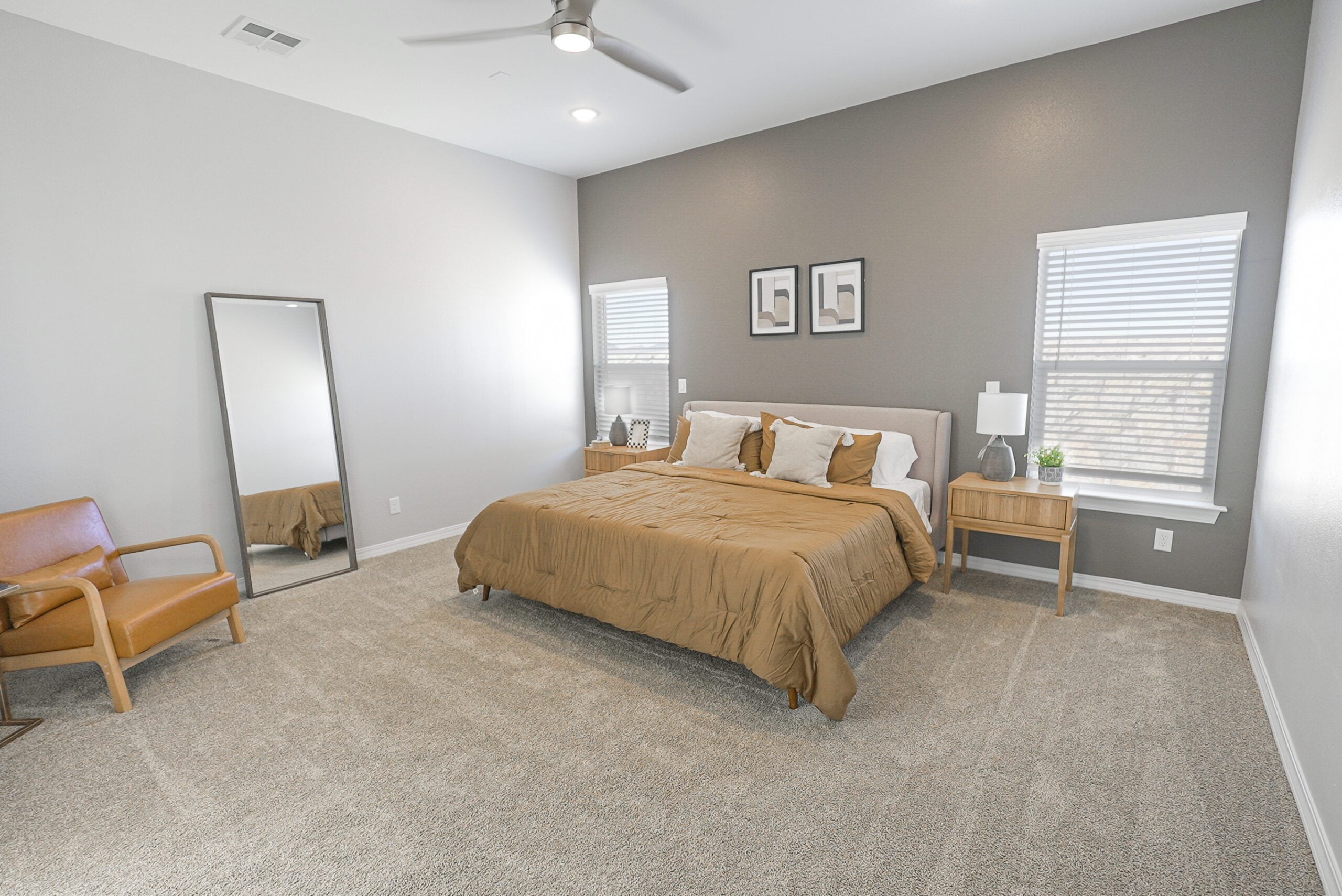 The Orchid Master Bedroom with two windows and a lot of open space.