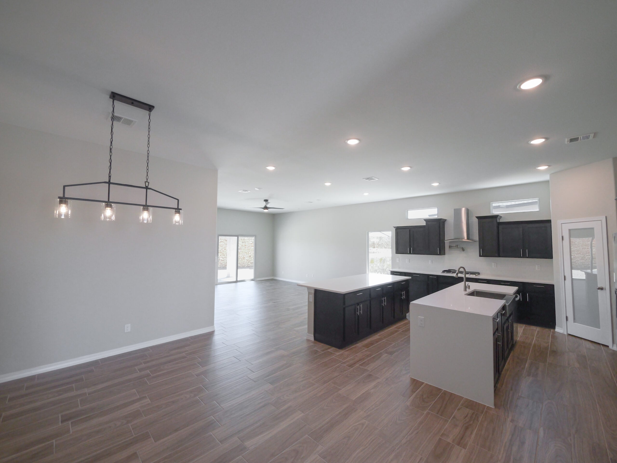 The Arum Family Area that is connecting the kitchen, dining area, and living room. Sliding glass doors.