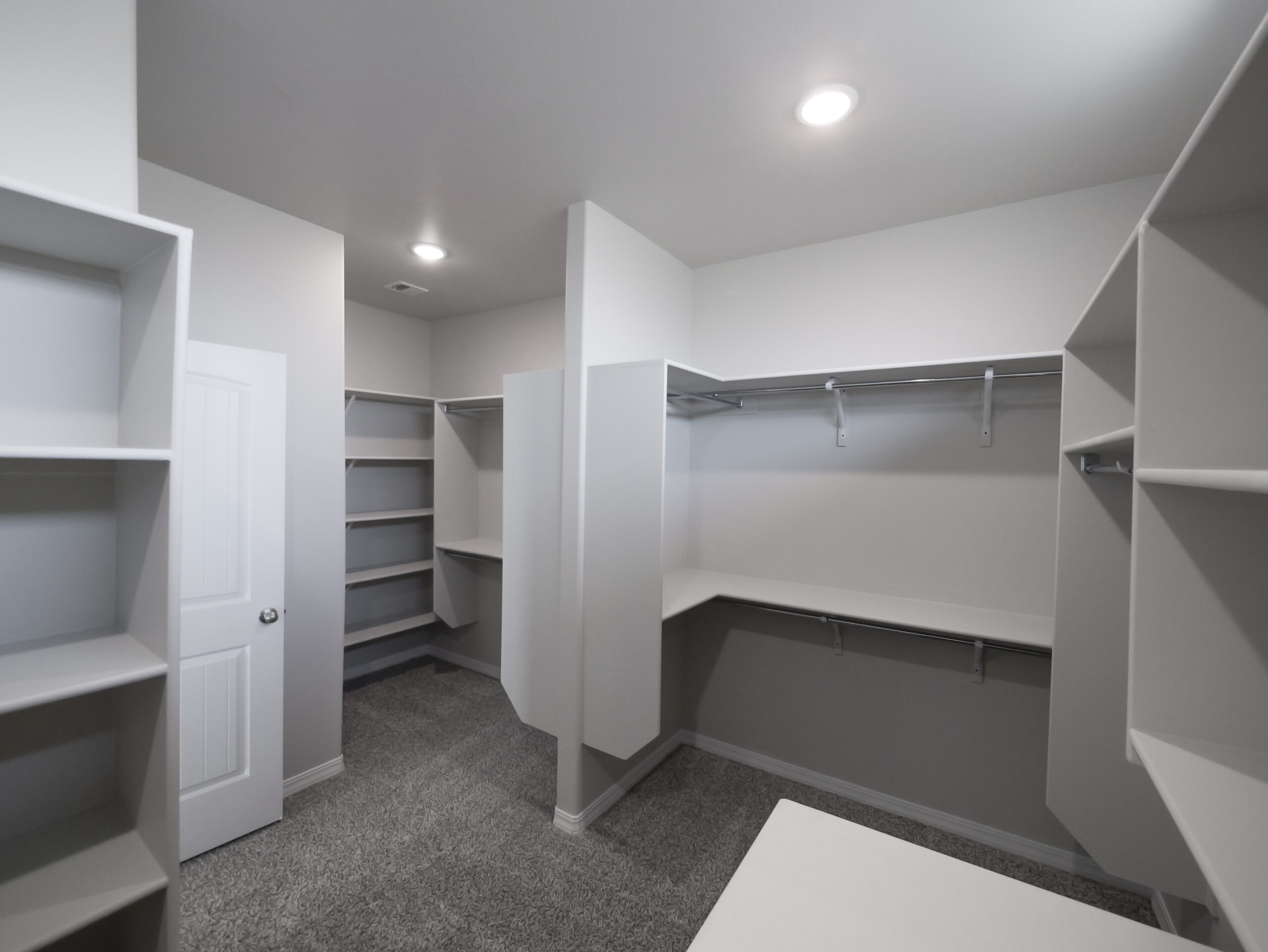 The Arum Master Walk-in Closet with lots of storage space and shelves.