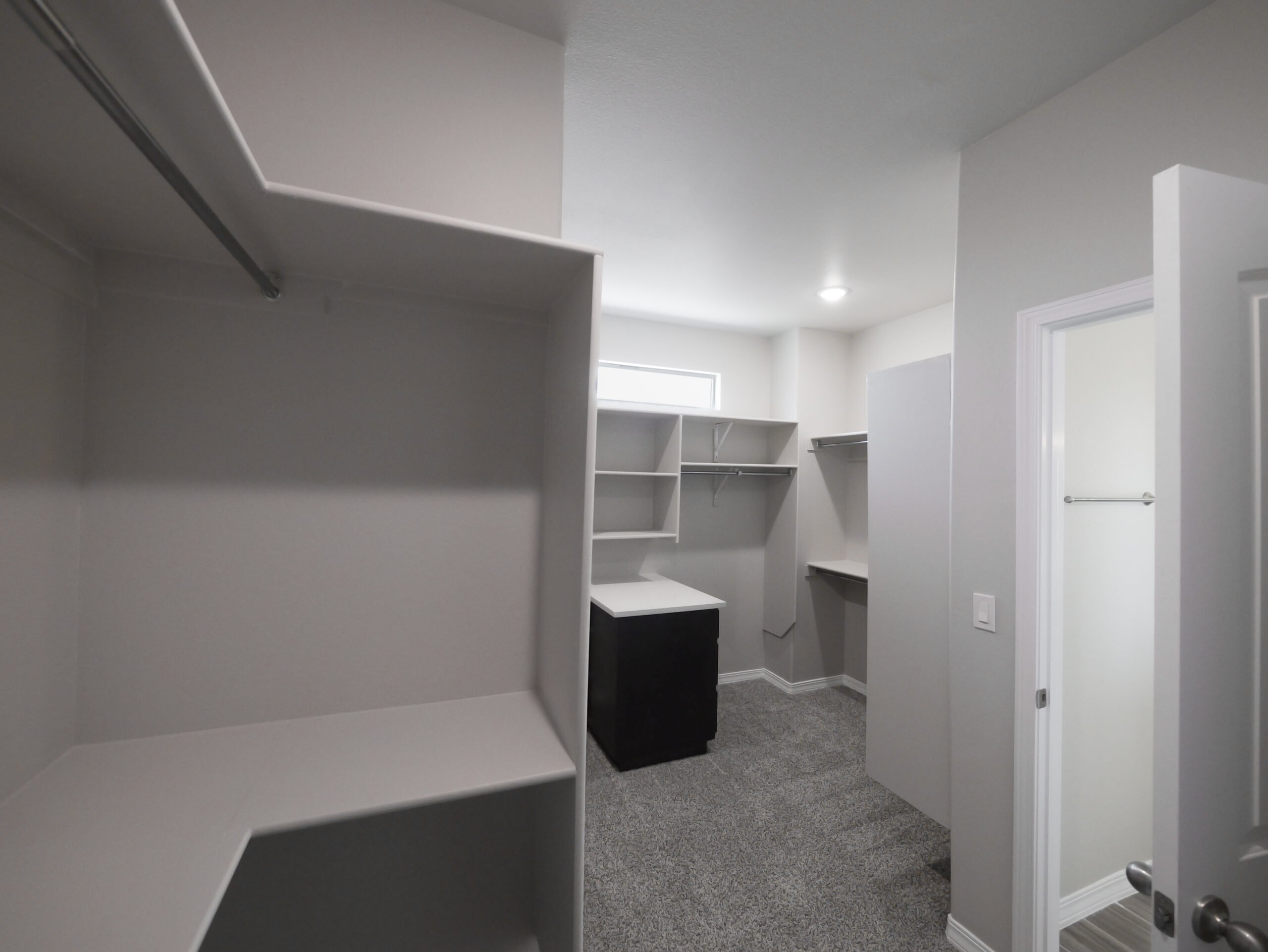 The Arum Master Walk-in Closet with lots of storage space and shelves.