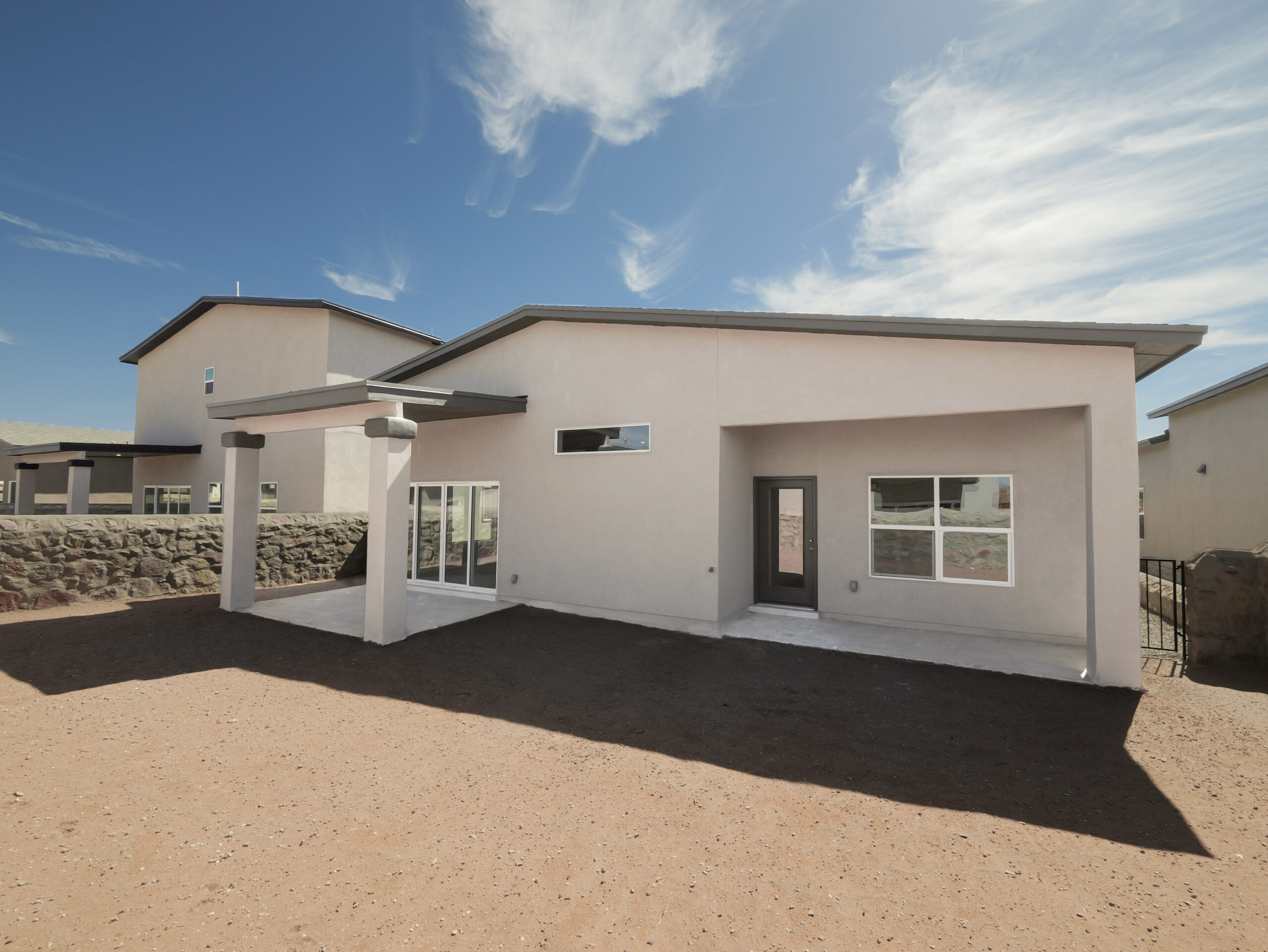 Hibiscus Backyard with plenty of space and two patios. There is a patio that connects to the living room area and a second patio that connects to the master bedroom.