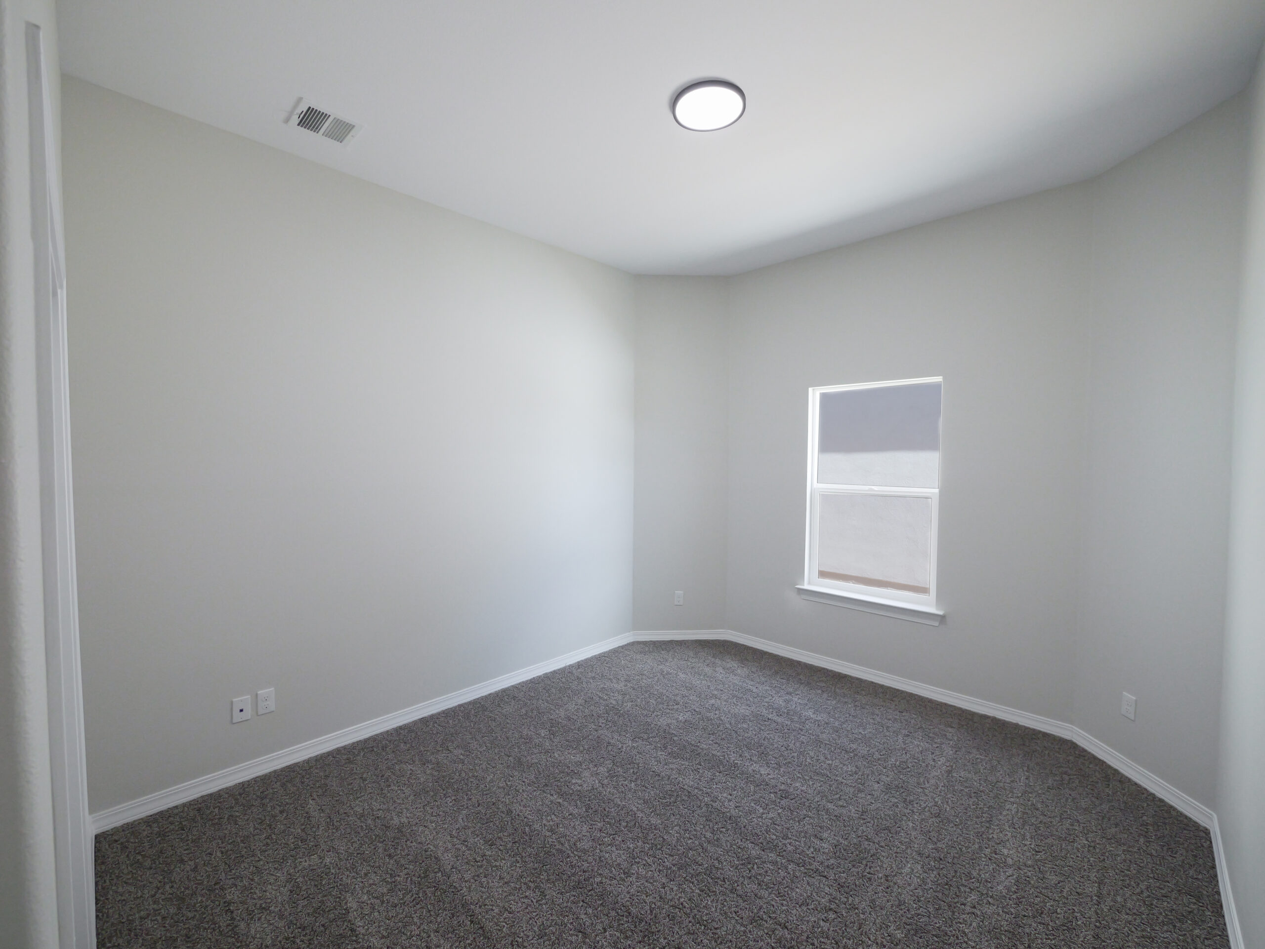 Hibiscus Bedroom with great natural lighting and carpet.