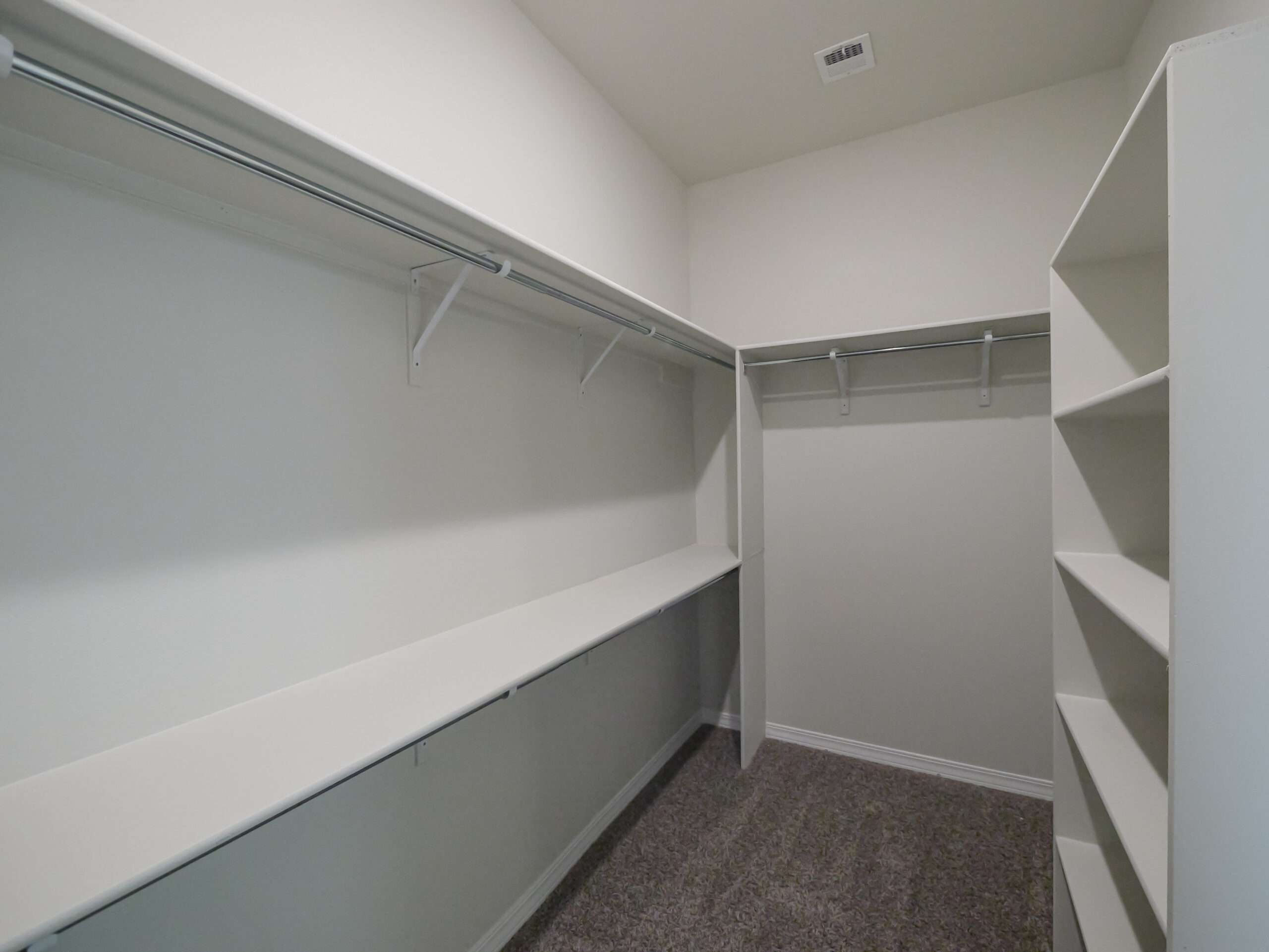 Hibiscus Master Closet with lots of storage space and shelves.
