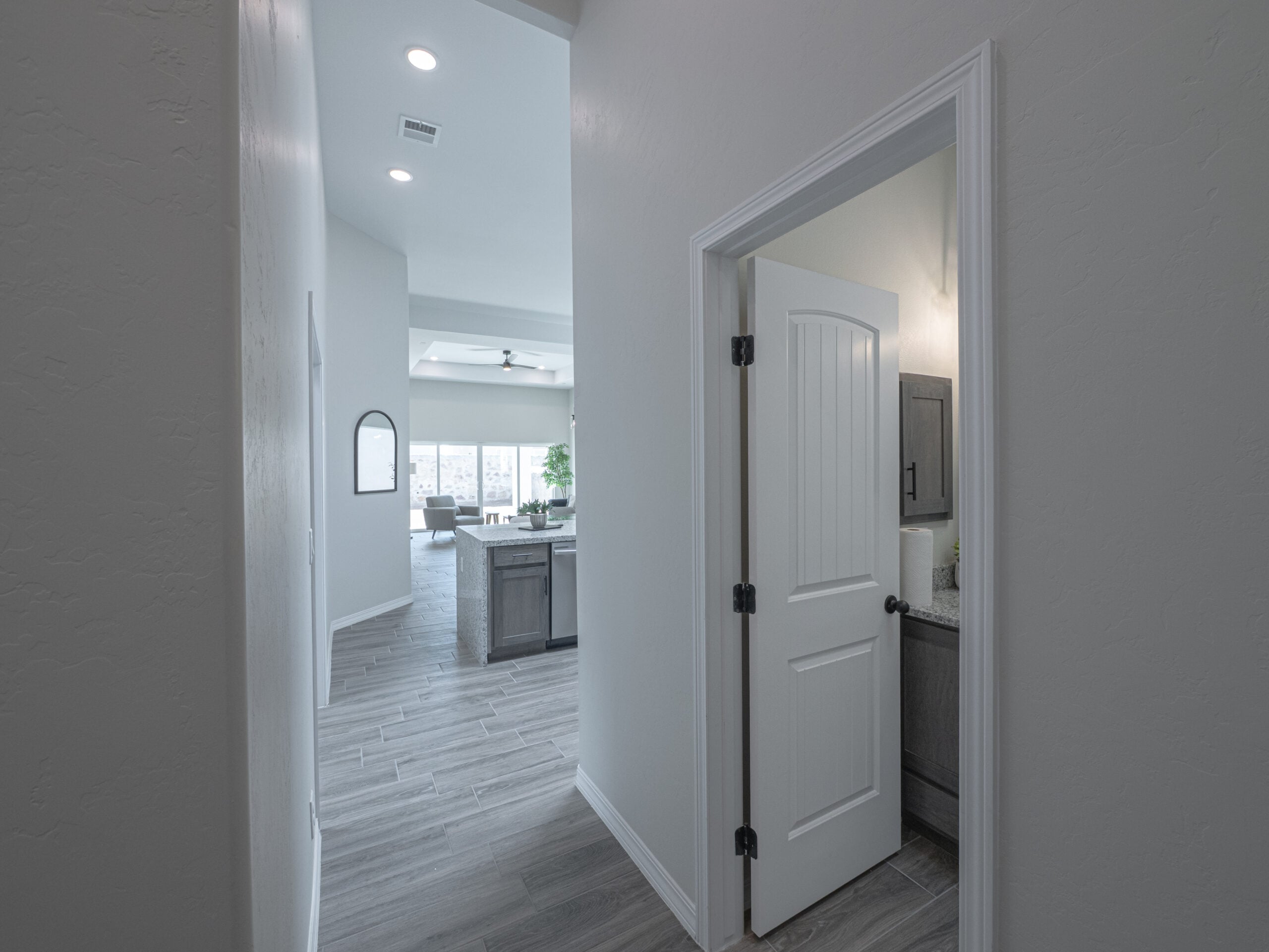 The Chai Entrance that leads to the open area where the kitchen, dining area, and living room.