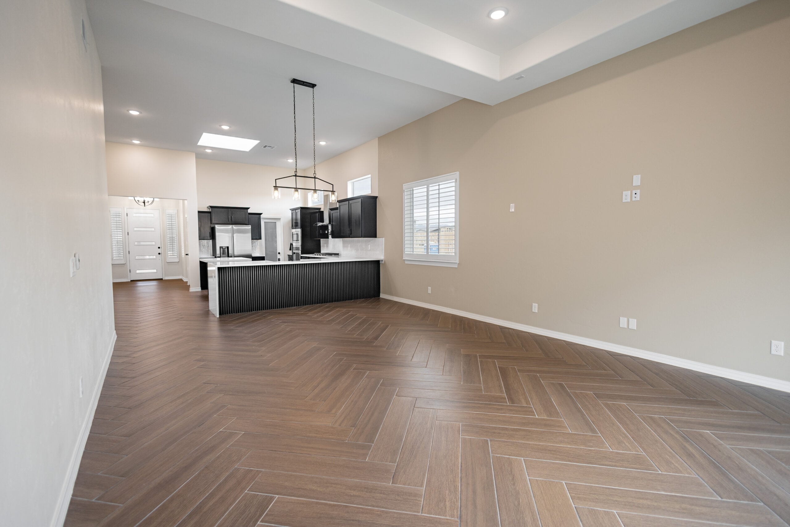 The Daisy Family Area where the kitchen, dining area, and living room are all connected.